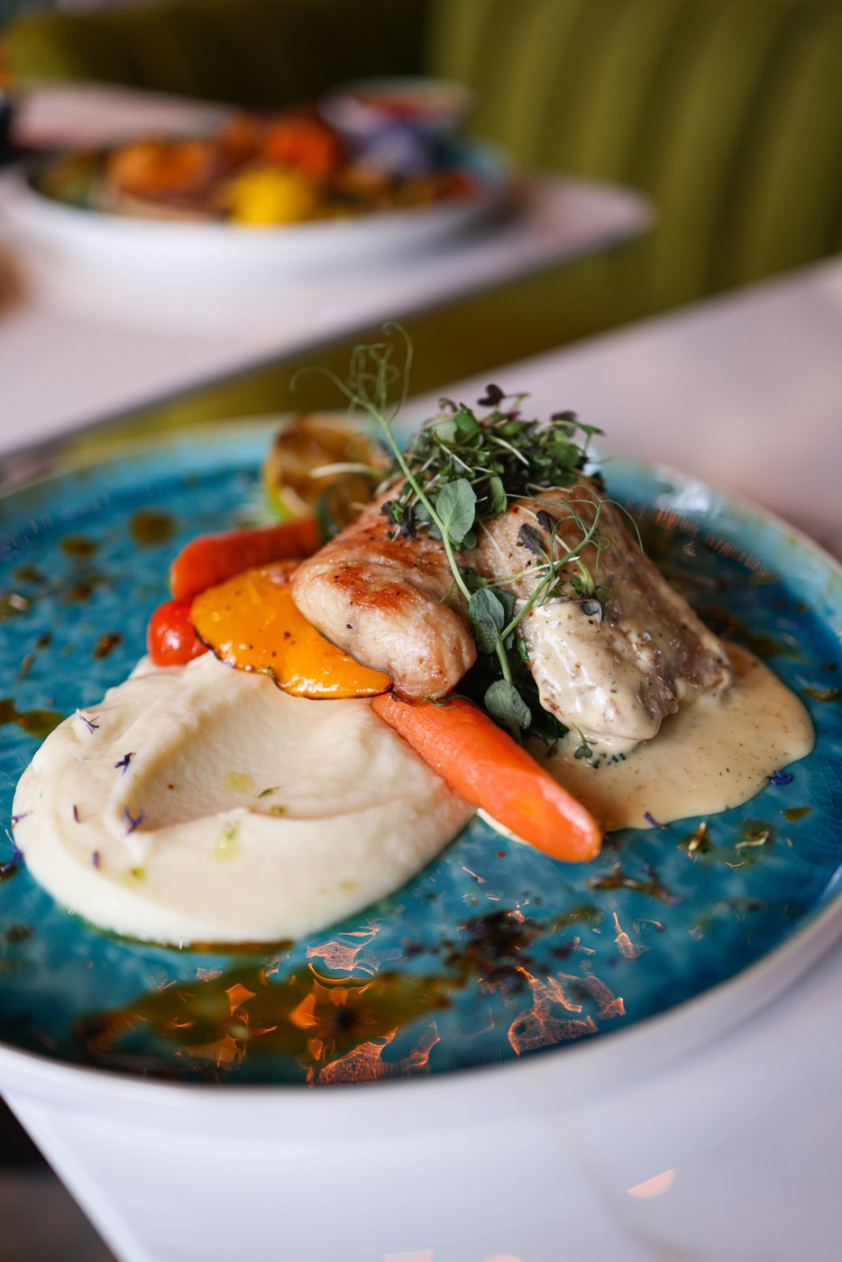 Restaurant fish dish served with wine
