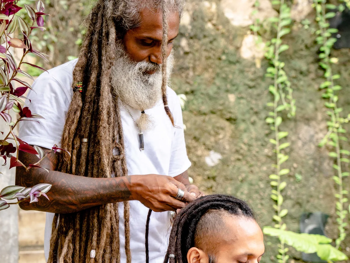 Professional styling a client's locs